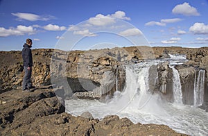 Traveler near Aldeyjarfoss Waterfall