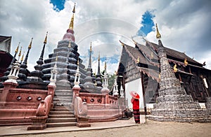 Traveler with red umbrella in Thailand