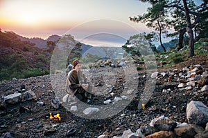 Traveler regaining her strength at Yanartash at sunset in Turkey