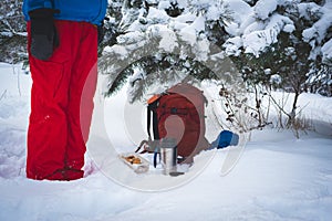 Traveler relaxing and drinking coffee from thermos