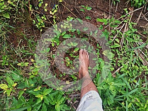 Traveler's Dirty Foot on the Ground When Climbing the Mountain