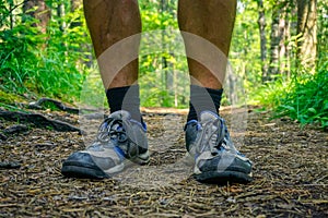 Traveler`s feet on the trail