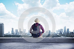 A traveler sitting on the rooftop