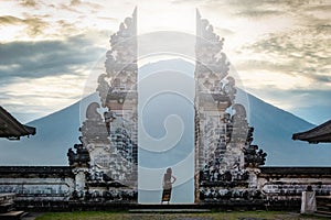 Traveler Standing at Ancient Gates of Pura Lempuyang Temple, Bali, Indonesia