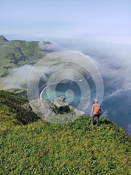 Traveler Standing on Edge of Shikotan Island and Looking on Pacific Ocean photo