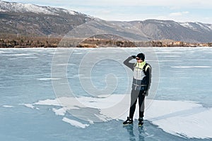 Traveler standing on ice.