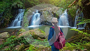 Traveler standing at Sapan Waterfall Namtok Sapan 1st floor is most beautiful waterfall of NAN province. Khun Nan National Park