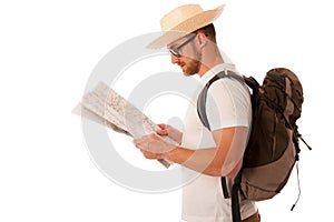 Traveler with straw hat, white shirt, backpack and map seems like he is lost.