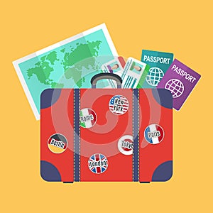 Traveler suitcase, earth map, passports