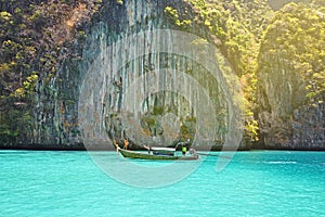 Traveler in summer relaxing on wooden boat ,vacation at Thailand