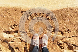 Traveler top view on sand with text travel. Adventures concept. Summer or desert
