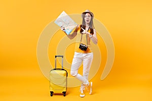 Traveler tourist woman in summer casual clothes, hat with suitcase, city map isolated on yellow orange background
