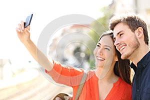 Traveler tourists couple photographing a selfie