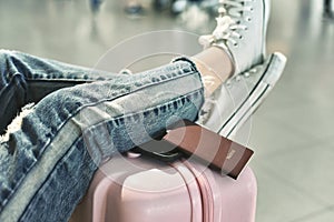 Traveler waiting for flight check-in at the airport.