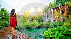 Traveler walk on path in Plitvice Lakes, Croatia