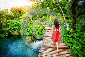 Traveler walk on path in Plitvice Lakes, Croatia.