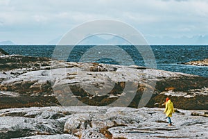 Traveler walking alone at Norway sea Travel Lifestyle concept adventure scandinavian vacations outdoor