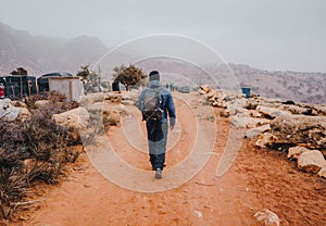 Traveler Walking in front of rural landscape in Taroudant Morocco.