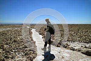 Traveler Walking on the Trail of Salar de Atacama, Extensive Chilean Salt Flat at the Altitude of 2,305 M.