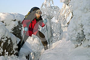 The traveler in the winter mountains steps over the abyss