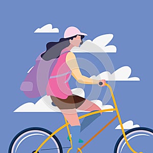 traveler woman with bag riding bicycle