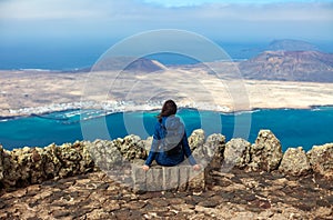 Traveler woman enjoying beautiful seascape at viewpoint