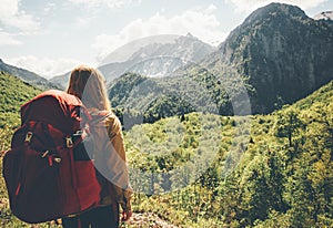 Traveler Woman hiking in mountains with backpack