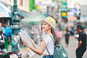 Traveler woman with map in bangkok city