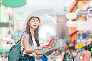 Traveler woman with map in bangkok city
