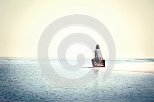 Traveler woman resting in front the spectacular ocean photo