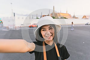 Traveler woman selfie on vintage tone for travelling concept background