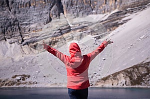 Traveler woman standing in freedom with arms up happy and looking beautiful view at outdoor,Travel concept