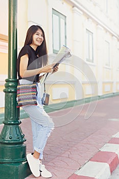 Traveler woman on vintage fashion planing on map for travelling concept background