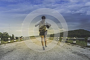 Traveler woman wolk and drinking with backpack. photo