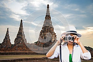 Traveler women covering her face with the camera