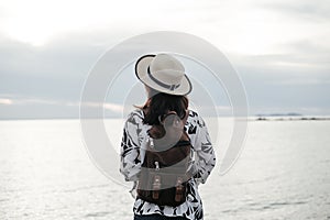 Traveler young woman in casual clothes with backpack stand alone