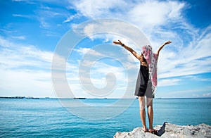 Traveler young women seeing the beautiful beach and blue sky,
