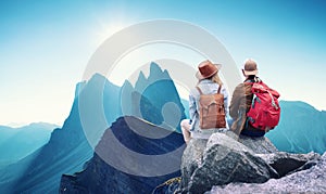 Travelers couple look at the mountains landscape. Travel and active life concept with team.