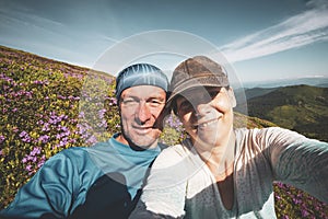 Travelers, friends taking selfie on the mountain trail