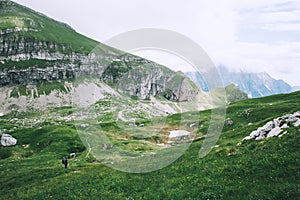 Travelers or hikers in the mountains in the National Park Triglav.