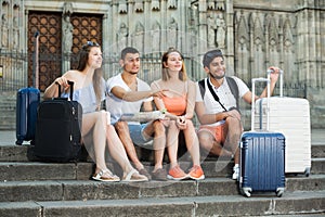 Travelers holding map and looking  way