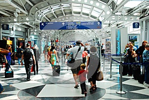 Travelers make their way through a maze of corridors at the airport