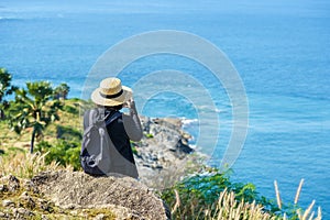 Travelers at Phromthep cape viewpoint at the south of Phuket Island, Thailand. Tropical paradise in Thailand. Phuket is a popular