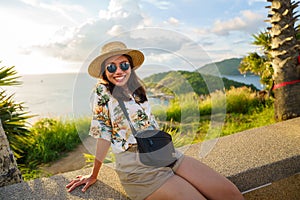 Travelers at Phromthep cape viewpoint at the south of Phuket Island, Thailand. Tropical paradise in Thailand. Phuket is a popular