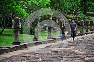 Travelers thai people lover couple travel visit and posing portatiat take photo at Prasat Hin Phanom Rung Stone Castle and