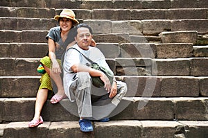 Travelers thai people lover couple travel visit and posing portatiat take photo at Prasat Hin Phanom Rung Stone Castle and