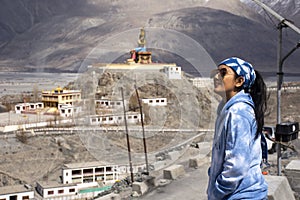 Travelers thai woman travel visit stand for take photo with Maitreya Buddha statue area near Diskit Monastery in Nubra valley