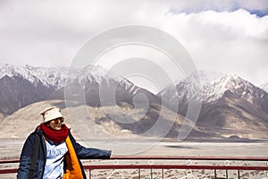 Travelers thai woman travel visit stand for take photo on Maitreya Buddha statue area near Diskit Monastery in Nubra valley