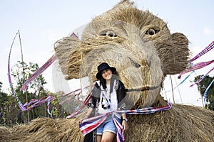 Travelers thai women people travel visit and posing portrait for take photo straw puppets or straws man figure Festiva