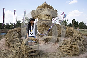 Travelers thai women people travel visit and posing portrait for take photo straw puppets or straws man figure Festiva